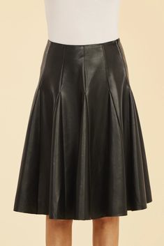 Introducing our Faux Leather Paneled Skate Skirt, the epitome of sophistication and edge. Designed with sleek panels and a flattering pleated silhouette, this knee-length skirt adds a playful yet structured touch to any outfit. Its dynamic movement and chic design make it the perfect pairing for your fall wardrobe. Made with high-quality faux leather and featuring a true to size fit, this skirt is a must-have for any fashionista. Dry clean for best care. Dynamic Movement, Skirt Design, Knee Length Skirt, Fall Wardrobe, Chic Design, Perfect Pair, Knee Length, Faux Leather, Dry Clean