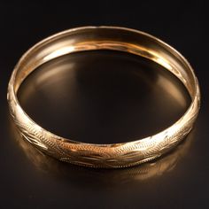 Vintage 1930's 14k Yellow Gold Etched Style Bangle Bracelet 18.1g 8" LengthMetal Information: 14k Yellow GoldTotal Weight: 18.1gWidth: 11.2mmLength: 8"Circa: 1930'sEstimated Retail Price: $2940.00OUR PRICE: $2350.0044505 Vintage Yellow Gold Bangle Stamped 14k, Vintage 14k Stamped Yellow Gold Bangle, Vintage 14k Gold Hallmarked Bangle, Antique Stamped 14k Bangle Bracelet, Vintage 14k Stamped Round Bangle, Antique 14k Gold Bangle Bracelet, Antique Round 14k Gold Bangle, Antique 14k Gold Round Bangle, Vintage 14k Stamped Bangle Bracelet