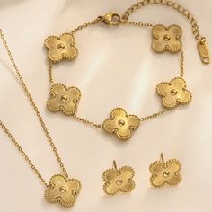 3 Piece Gold Clover Set. Double-Sided Necklace And Bracelet Stainless Steel 18 Kt Gold Plated Hypoallergenic Water Resistant Alhambra Style. Elegant Gold Flower-shaped Jewelry, Elegant Stainless Steel Jewelry Sets As A Gift, Elegant Stainless Steel Jewelry Sets For Gift, Elegant Gold-tone Stainless Steel Jewelry, Gold Plated Flower Shaped Jewelry With Matching Earrings, Minimalist Jewelry With Matching Flower-shaped Earrings, Minimalist Flower-shaped Jewelry With Matching Earrings, Tarnish Resistant Stainless Steel Jewelry For Party, Elegant Tarnish-resistant Stainless Steel Jewelry