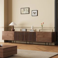 a living room scene with focus on the sideboard and table in the foreground