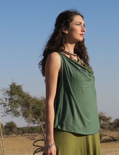 Style - The Float Neck style is a simple yet chic, low draping front neckline. For a higher front drape, view our Cocoon style. Shape - The Wanderer shape opens at the armpit into a full-bodied, flowy A-line design. Racerback - A highly functional T-shaped back. Size - Order based on BUST measurement Fabric Shown - Tissue Hemp/Organic Cotton Knit Color Shown - Blush, Seafoam Versatile Draped Summer Top, Casual Summer Top With Cowl Neck, Summer Casual Cowl Neck Top, Casual Cowl Neck Top For Summer, Summer Cowl Neck Top, Versatile Summer Cowl Neck Top, Versatile Cowl Neck Summer Top, Gaia Conceptions, Above Elbow