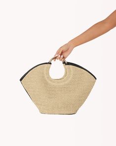 Crafted from natural raffia for a touch of timeless elegance, the Dawn Tote Bag is the perfect everyday companion. Composition and Fit: Spacious main compartment: Ample room for all your essentials, from your wallet and keys to a book and a water bottle. Natural raffia construction: Offers a beautiful, woven texture that is both stylish and sustainable. Black cotton lining: Provides a touch of contrast and keeps your belongings protected. Comfortable, double shoulder straps: Allow for effortless Daily Use Woven Sand-colored Beach Bag, Eco-friendly Rattan Tote Beach Bag, Eco-friendly Straw Beach Bag With Woven Leather, Eco-friendly Woven Beach Bag With Double Handle, Eco-friendly Rectangular Woven Beach Bag, Mignonne Gavigan, Craft Tote Bag, Tony Bianco, Oversized Tote Bag