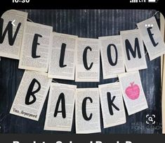 the welcome back sign is made out of old book pages and has an apple on it