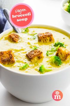 broccoli soup with croutons in a white bowl