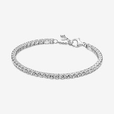 Tennis bracelets, anyone? This sterling silver Sparkling Tennis Bracelet features squared collets and is decorated with a bold line of clear cubic zirconia to make a statement fit for any occasion. Wear it on its own or stack bracelets of different colors and metal finishes for a modern look. - Pandora Sparkling Tennis Bracelet - Sterling silver / Cubic Zirconia / Clear - Sz. 7.9 in Classic Sterling Silver Bracelet With Sparkling Stones, Classic Silver Sparkling Diamond Bracelet, Modern Silver Bracelets With Sparkling Stones, Classic Silver Tennis Bracelet With Sparkling Details, Classic Silver Sparkling Tennis Bracelet, Timeless Silver Jewelry With Rhinestones, Timeless Silver Sparkling Jewelry, Timeless Sparkling Silver Jewelry, Classic Formal Bracelets With Rhinestones