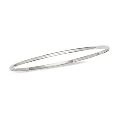 A timeless classic, this sleek bangle elevates any attire. Crafted in cool 14K white gold, this slender 2.0mm-wide design is a great complement to her other bracelets. Polished to a bright shine, this 7.5-inch bracelet slips on and off with ease. Minimalist Stackable White Gold Bangle, Classic Stackable Sterling Silver Bracelet, Minimalist Sterling Silver Bangle With Shiny Finish, Classic Polished Hoop Bracelets, Classic Hoop Bracelets With Polished Finish, Sleek Polished Bangle Jewelry, Sleek Polished Bangle Bracelet, Minimalist Sterling Silver Bangle For Formal Occasions, Classic Stackable Hoop Bangle