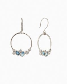 The Stone Cluster Drop Earrings feature a gently hammered sterling silver loop shape adorned with a cluster of ocean-inspired blue and clear stones. This elegant yet whimsical design will complement any jewelry collection. Metal: Sterling silver Stones: London blue topaz, Hampton blue topaz, white zircon Dimensions: 35mm x 12mm Style #: E197LbHbZ Anniversary Blue Topaz Multi-stone Earrings, Anniversary Multi-stone Blue Topaz Earrings, Blue Multi-stone Sterling Silver Earrings, Silver Oval Cluster Earrings In Sterling Silver, Oval Sterling Silver Cluster Earrings, Oval Silver Cluster Earrings In Sterling Silver, Sterling Silver Gemstone Cluster Earrings, Sterling Silver Gemstone Cluster Earrings Fine Jewelry, Modern Blue Topaz Jewelry With Gemstone Accents