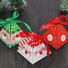 three small boxes with christmas designs on them