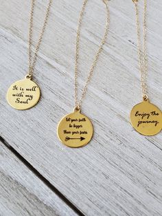 "Lovely inspirational gold necklaces feature laser engraved pendants with beautiful quotes, each one with words of wisdom. They hang from gold filled chain. Pendants measure 20\". Select your desired quote and length from the drop box. All your items will be packaged and shipped in a cotton filled kraft box. ~The best way to prevent tarnish is to wear your jewelry regularly. When not wearing your jewelry, the best way to protect it is to store it in a sealed plastic bag. Humidity, chemicals and Meaningful Personalized Gold Necklaces, Personalized Gold Necklaces With Meaningful Style, Personalized Meaningful Gold Necklaces, Meaningful Gold Necklace For Personalized Gift, Personalized Gold Necklaces, Meaningful Personalized Gold Necklace, Meaningful Gold Pendant Necklace, Spiritual Hand Stamped Necklaces For Personalized Gift, Gold Personalized Spiritual Charm Necklaces