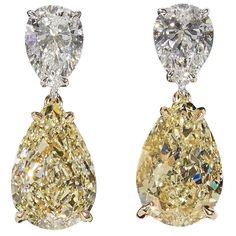 An impressive pair of diamond earrings! Each of the four diamonds are certified by GIA! 6.80 carats of Fancy Light Yellow diamonds, VS2. 2.01 carats of white, F color diamonds, SI1. 18k white and yellow gold Approximately .80 inches in length. Elegant and timeless these earrings were designed and made in New York. Tiny Diamond Earrings, Diamond Star Earrings, Yellow Diamond Earring, October Birthstone Jewelry, Fancy Light, White Diamond Earrings, Yellow Diamonds, Opal Earrings Stud, Tiny Stud Earrings