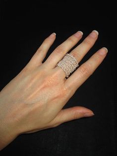 a woman's hand with a ring on it