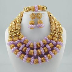 a necklace and earring set made out of beads