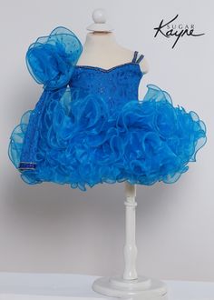 Make your little princess feel like the belle of the ball in the C218 - Sugar Kayne Kids Cupcake Dress! With its organza ruffled skirt and corset tie in the back, this dress brings sweet sophistication to any occasion. Ruffled organza skirt adds volume and flair Sweetheart neckline and corset tie create an elegant look Perfect for birthday parties, weddings, holidays, and more The voluminous ruffled skirt made of delicate organza fabric will have your daughter twirling with joy. The flattering s Tulle Dress With Ruffles For Dress-up, Elegant Fitted Ruffle Dress For Dress-up Occasions, Blue Tulle Dresses With Ruffled Skirt, Blue Tulle Dress With Ruffled Skirt, Tulle Dress With Ruffled Skirt And Straps, Tulle Ball Gown With Ruffled Skirt, Tulle Ball Gown Dress With Ruffled Skirt, Tiered Ruffle Princess Dress For Dress-up, Tiered Princess Dress With Ruffles For Dress-up