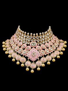 "Gulrukh Meenakari Bridal Set - Pink A pure hand-drawn detailed jewelry in the shades of soft pink and green meenakari work. This piece displays high-quality workmanship and fine usage of stones! This meenakari necklace set is perfect for western or traditional outfits. This set features a necklace with jadai detailing, featuring kundan chand motifs with lotus meenakari detailing. Delicate necklace accented with kundan stones and faux pearls creating a lush, sparkling set. The set includes a pai Round Kundan Necklace With Meenakari, Traditional Ceremonial Kundan Necklace With Meenakari, Heavy Designer Kundan Necklace For Festive Occasions, Designer Silver Jewelry With Stone Work, Designer Gold Necklaces For Festivals, Ceremonial Kundan Jewelry With Motifs, Ceremonial Kundan Necklace With Motifs, Designer Kundan Necklace For Festivals, Meenakari Chandbali Choker