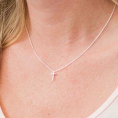 This tiny silver cross necklace is a classic addition to your layering necklaces. This minimalist necklace is also perfect by itself. The cross charm is sterling silver and measures approximately 12 mm in length or 1/2 inch. The chain is delicate looking but sturdy sterling silver. This dainty cross necklace is available in lengths from 15 - 18 inches. You may choose to add an attached extender. Your new necklace will come in a box, ready for gift giving. More Christian jewelry https://www.etsy. Dainty Cross Necklace, Tiny Cross Necklace, Cross Necklaces, Silver Cross Necklace, Tiny Cross, Sterling Silver Cross Necklace, Layering Necklaces, Small Necklace, Gold Cross Necklace