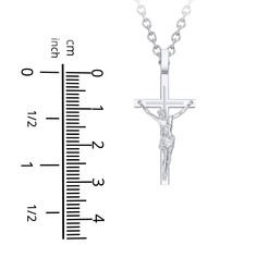 Made in sterling silver, this meaningful crucifix necklace is a beautiful symbol of faith. Classic Engraved Crucifix Necklace, Classic Sterling Silver Crucifix Necklace, Classic Silver Crucifix Necklace, Classic Sterling Silver Cross Charm, Elegant Sterling Silver Crucifix Necklace, Classic Engraved Crucifix Cross Necklace, Classic White Gold Crucifix Necklace, White Gold Crucifix Necklace Spiritual Style, Sterling Silver Crucifix Necklace In Spiritual Style