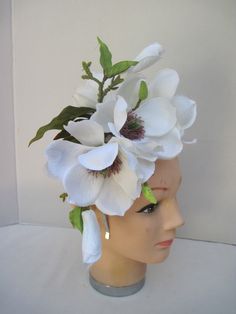 * This Magnolia headpiece has been designed on a high polish silver metal headband that is comfortable and will fit any head size. * The design has open Magnolia flowers along with buds and opening blossoms. * It can be worn all year round and for varied occasions. * All of the design is secure, evenly balance and comfortable to wear and will fit any head size. * Great to wear to Diner en Blanc, weddings, various showers, birthday celebrations, tea parties, dinner engagements, Horse Race Events, Adjustable Handmade Flowers Headband For Garden Party, Adjustable Pinched Crown Headpiece For Garden Party, Adjustable Flower Shaped Fascinator For Garden Party, Flower Headpieces For Kentucky Derby, Handmade Flower Headpieces For Garden Party, Adjustable Flower Headband For Garden Party, Adjustable Floral Headband For Garden Party, Adjustable Headpieces With Matching Headband For Garden Party, White Headband For Garden Party