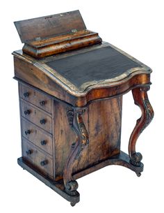 an old wooden desk with drawers and a large leather top on it's legs