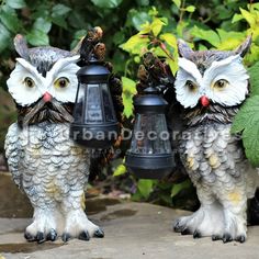 two owl figurines are sitting next to each other