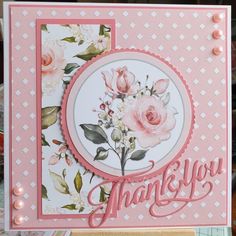 a thank you card with pink flowers on the front and bottom, surrounded by other cards