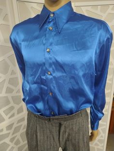 This is an 1980s bright blue satin long sleeve shirt by tge Mendoral label in a oversize Medium  The condition is good. Best fit medium to large Chest 116cm Length shoulder to hem 75cm Satin Shirts, Mens Dress Shirts, Satin Long Sleeve, Mens Dress, Azure Blue, Blue Satin, Tee Dress, Mens Shirt Dress, Dress Shirts