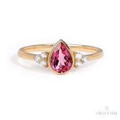 DetailsMaterial: 14k/18k GoldColor Options: Yellow Gold, White Gold, Rose Gold,★ Center Stone:Pink Tourmaline, PearSize: 5 x 7 mmApprox Weight (Ct): 0.69★ Accent Stones:Diamond RoundSize: 1.5 mm * 6 No.sApprox Weight (Ct): 0.084 Tourmaline Engagement Ring, Pink Engagement Ring, Pink Tourmaline Ring, Natural Gemstone Jewelry, 18k Gold Ring, Tourmaline Ring, Rings For Her, White Rose Gold, Pink Tourmaline