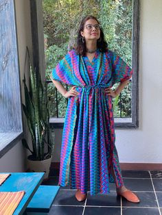 I made this caftan dress from a beautiful diamond aztec pattern and is available in many colors. I used the softest mulmul cotton fabric to make this. It is extremely soft and it gets softer with every wash. It is so free flowing, that it will make you feel as if you aren't wearing anything at all ;) The beauty of the Kaftans is they will fit everyone so no need to worry about the size et all. All my Kaftans have deep necks(11-12 inches) so will fit all head sizes. However, the length of my kaftans will vary. I make them according to your height and in both knee and ankle length option. It has a drawstring at the waistline. In the pictures, I have shown when it is relaxed and when I have tightened the drawstring. Please note there might be slight color variation due to lighting and all. Yo Multicolor Ikat Print Kaftan Tunic, Multicolor V-neck Kaftan With Batik Print, Green V-neck Kaftan With Vibrant Print, Paisley Print Short Sleeve Maxi Dress For Beach, Short Sleeve Paisley Print Maxi Dress For Beach, Short Sleeve Paisley Maxi Dress For Beach, Green Paisley Print Maxi Dress For Vacation, Multicolor Paisley Print Maxi Dress For Vacation, Multicolor Paisley Print Maxi Dress For Festival