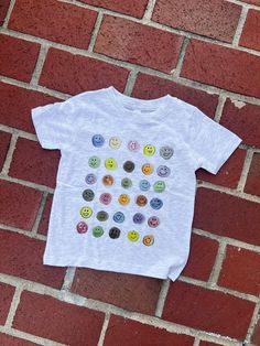 This All the Moods T-shirt is so fun and colorful for any little one! *Also available in an adult t-shirt and crewneck Fun Crew Neck T-shirt With Funny Print, Playful Unisex T-shirt With Character Print, Playful Cartoon Print Crew Neck T-shirt, Casual Letter Print T-shirt For Playtime, Cute Letter Print T-shirt For Playtime, Playful Crew Neck T-shirt With Cartoon Print, Unisex Short Sleeve T-shirt For Playtime, Screen Print Short Sleeve T-shirt For Playtime, Crew Neck T-shirt With Character Print For Playtime