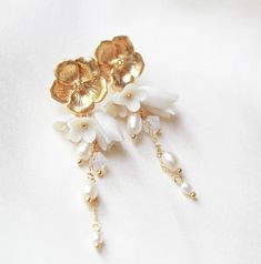 Floral Bridal Earrings, Gold Bridal Jewelry, Pearl Earrings for Bride, Long Wedding Earrings, Gold Flower Earrings Stud Earrings for Wedding - Etsy Elegant Rose Gold Flower Clip-on Earrings, White Pearl Drop Clip-on Earrings For Wedding, Gold Elegant Flower Earrings With 3d Flowers, Elegant Gold Flower Earrings With 3d Details, Delicate Gold Pearl Chandelier Earrings, Elegant Flower Shaped Chandelier Earrings, Gold Pearl Chandelier Earrings Delicate Style, Gold Pearl Chandelier Earrings In Delicate Style, Elegant Gold Jewelry With 3d Flowers