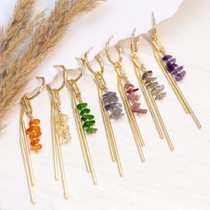 Raw Crystal Bar Drop Hoops, Colorful Birthstone Earrings Gift Daughter or Friend, Beaded Tassel Dangle Huggie Hoops, Long Bar Charm Huggies ✨ These earrings feature a beaded bar of genuine raw crystals & a 2-bar charm hanging from a dainty huggie hoop. Available in Gold finish. ✨ The simplicity of these earrings make them ideal gifts. They are lightweight and easy to match with your wedding color palette! Understated yet elegant, they can be paired with virtually any style of dress. PLEASE NOTE: These earrings are sold as SINGLES (1 Hoop total) or as PAIRS (2 Hoops total) --> Stacking Charm Hoops Available to Purchase HERE: https://www.etsy.com/listing/1522629950/ H O W ∙ T O ∙ O R D E R 1st DROP DOWN menu: * Select the GEMSTONE OPTION you would like 2nd DROP DOWN menu: * Select if you wou Bridesmaids Earrings, Quilling Work, Raw Crystals, Earrings Diy, Birthstone Earrings, Small Charms, Long Dangle Earrings, Birthstone Gifts, Birthstone Earring