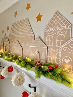 a mantle with christmas decorations and lights on it