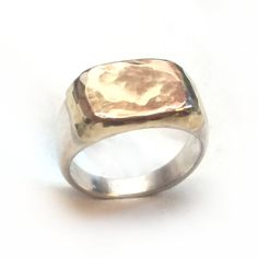 A pinky ring made of sterling silver and 10k red gold sheet soldered on top. This ring can fit other fingers as well. The gold can be red (pink), white or yellow gold if you wish. Measurments: Width: 0.43 inch x 0.59 inch / 11 mm x 15 mm Thickness: 0.11 inch / 3 mm This listing is for sizes 3.5-8. For other sizes - please convo me. Additional information If you liked this item, you may also want to look at these pieces: http://etsy.me/2fHziIR http://etsy.me/2fivdh1 For customer reviews of our sh Hand Forged Sterling Silver Signet Ring For Anniversary, Handmade 14k Gold Silver Signet Ring, Silver Hammered Signet Ring As Gift, Rose Gold Sterling Silver Signet Ring, Engraved Rose Gold Sterling Silver Signet Ring, Silver Hammered Signet Ring For Anniversary, Rose Gold Sterling Silver Engraved Ring Hallmarked, Rose Gold Sterling Silver Engraved Ring, Rose Gold Sterling Silver Engraved Ring With Hallmark