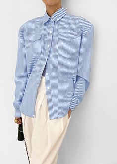 Color: White Stripe Crisp woven shirting fabric Relaxed fit Padded shoulders Pointed collar Flap breast pockets Button cuffs Curved hem Button front closure 80% Polyester 20% Cotton Imported Product Measurements: S- 20" Shoulder, 44" Bust, 26" Length M- 20.5" Shoulder, 46" Bust, 26.5" Length L- 21" Shoulder, 48" Bust, 27" Length Model is 174cm/ 5'8" wearing size S Collared Office Tops With Buttoned Pockets, Office Tops With Collared Buttoned Pockets, Collared Tops With Buttoned Pockets For Office, Office Tops With Buttoned Pockets And Collar, Collared Tops With Buttoned Pockets For Business Casual, Spring Tops With Striped Fold Down Collar, Spring Shirt With Fold Down Collar And Pockets, Spring Shirt With Pockets And Fold Down Collar, Spring Shirt With Buttoned Pockets And Spread Collar