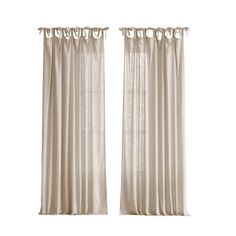 two white curtains with ruffled trims