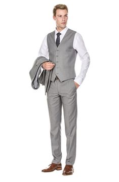 Bring understated elegance to the table in this three-piece suit crafted from rich fabric in a classic single-breasted silhouette. Jacket has notched lapels; chest welt pocket; front flap pockets Vest has front button closure; V-neck Pants have zip fly with button closure; front slant pockets; back button-welt pockets Jacket and vest are lined; trousers are lined to the knee 65% polyester, 35% viscose Dry clean Imported Each suit has a 6” drop, meaning that a size 38R jacket is paired with size Slim Fit Sets With Pockets And Notch Lapel, Tailored Formal Suits With Pockets, Tailored Suits With Pockets For Formal Occasions, Slim Fit Single Breasted Set With Notch Lapel, Semi-formal Slim Fit Single Breasted Three-piece Suit, Slim Fit Three-piece Suit With Welt Pockets, Slim Fit Single-breasted Three-piece Suit, Slim Fit Workwear Sets With Pockets, Classic Formal Suit