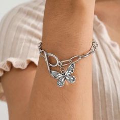 Introducing Our Stunning Butterfly Pendant Chain Bracelet Welcome to our store, where elegance meets affordability! Our Butterfly Pendant Chain Bracelet is a timeless piece that adds a touch of grace to any outfit. Crafted with precision and passion, this bracelet embodies the essence of charm. This bracelet is designed for the modern woman who appreciates beauty and quality. With its straight-line buckle chain and delicate butterfly pendant, it effortlessly blends Korean fashion sensibilities with international appeal. Embrace your femininity with this exquisite piece, perfect for both casual outings and special occasions. Product Features: Chain & Link Bracelet Made of high-quality zinc alloy Charming bowknot design Easy-hook clasp for convenience Available in a stunning silver color Lig Dainty Alloy Bracelet Jewelry, Dainty Alloy Bracelet, Trendy Stainless Steel Charm Bracelets, Elegant Alloy Bracelets With Silver Chain, Elegant Silver Chain Alloy Bracelet, Silver Stainless Steel Friendship Jewelry, Silver Metal Friendship Bracelets, Minimalist Silver Alloy Bracelets, Minimalist Metal Bracelet With Charms