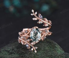 - Metal: Solid gold(10K/14K/18K white/yellow/rose gold),925 sterling silver,platinum available- Main Stone: 6x8mm oval cut natural moss agate- Accent Stone: 1.5mm lab alexandrites- Wedding Band Stone: alexandrites and moissanites- Band Width: 1.3mm- Can be personalized: Yes Miss Agate Wedding Band, Wedding Rings Forest Theme, Moss Agate Ring Set, Moss Agate Wedding Ring Set, Elvish Engagement Rings, Untraditional Wedding Rings, Nature Inspired Wedding Rings, Nature Inspired Engagement Rings, Fantasy Wedding Rings