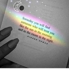 someone is holding an open book with a rainbow in the background and a quote on it