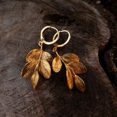 Gold plated Woodlands Leaf Hoops Earrings Gold Plated Brass/Silver Plated Brass Transform your Autumn in a magic experience with these Woodland Leaf hoops Earrings, made of 14k gold plated brass. The leaves are matte gold plated. Lightweight and comfortable, easy to wear and dainty, these earrings are the perfect addition for your autumn vibes! Also available in silver plated brass, with 925 Sterling Silver Hoops. DETAILS: - color: gold - material: 14k gold plated brass - leaf size: 31 mm - tota Gold Leaf-shaped Single Earring, Gold Single Leaf-shaped Earring, Brass Drop Huggie Earrings As A Gift, Gold-plated Leaf-shaped Earrings, Leaf-shaped Single Earring As A Gift, Leaf-shaped Yellow Gold Brass Jewelry, Gold Leaf-shaped Jewelry For Jewelry Making, Leaf-shaped Brass Earrings For Gift, Leaf-shaped Brass Earrings As Gift