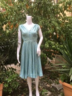 Romantic original 50s summer light blue pattern dress. V cleavage front and back. Small gathering on the shoulders, circle skirt. Hidden zip on the hip. The dress fit a 38/40 italian size (corresponding to a 2/4 US size) measurements: breast circumference 88 cm - 34.64" waist 64 cm - 25.19" free hips length 102 cm - 40.15" No tag. In some point the color is a bit yellowed and there is a faded ink, probably, spot on the skirt, please see pictures. Good vintage condition. NOTE: Items are freshly c Vintage Style Midi Length Summer Dresses, 1950s Style Blue Summer Dress, Vintage Style Summer Midi Dresses, Summer Vintage Dress With V-neck, Light Blue Retro Summer Dress, Retro Light Blue Summer Dress, 1950s A-line Vintage Summer Dress, Fitted Summer Vintage Dress Tea Length, 1950s Blue Summer Dress