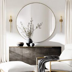 a room with a round mirror on the wall