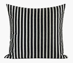 a black and white striped pillow on a white background