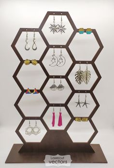 a display case with many different earrings on it