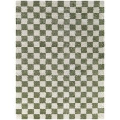 a green and white checkered rug on a white floor with an area rug in the middle