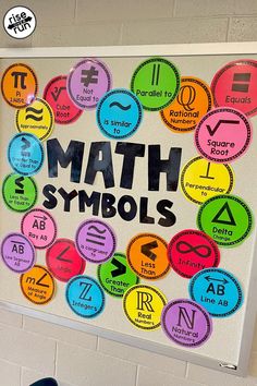 a bulletin board with the words math symbols in different colors and sizes on it next to a pair of blue shoes