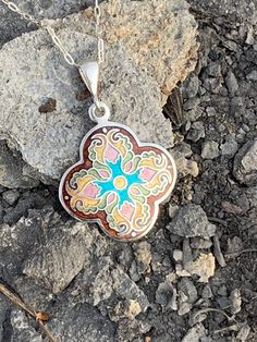 "Enamel Cross Cloisonne Necklace Handmade Religious Fine Sterling Silver Pendant Handmade by me and my 19 year old son in our beautiful Kansas City studio. See our work and follow us on Instagram please. Questions and comments are welcome. Get free shipping when you become our follower. Instagram: https://www.instagram.com/anaraandco/ Tiny fine silver wires bent according the design and then filled with Japanese glass enamel and fired numerous times in the kiln at 1500 degree F. Grinded with dia Bohemian Sterling Silver Flower Necklace, Handmade Brown Flower Jewelry, Sterling Silver Brown Round Pendant Necklace, Brown Sterling Silver Round Pendant Necklace, Brown Flower-shaped Jewelry Gift, Handmade Brown Flower Pendant Jewelry, Artisan Multicolor Medallion Jewelry, Handmade Artisan Sterling Silver Necklace, Handmade Artisan Sterling Silver Custom Necklace