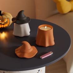 a table topped with candles and halloween decorations