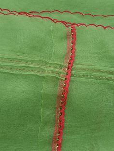 A straight-cut kurta in cotton silk fabric with all-over floral buttis made using A straight-cut kurta in cotton silk fabric with all-over floral buttis made using beads, sequins and silk French knots. Kurta, pants and dupatta have a lace edging at the hem, side cut, and sleeve ends. Bead work runs along the neckline and in between lace patterns. Delicate pin tucks stitched across the organza dupatta with embroidered scalloped edges and machine stitches in between pin tucks. Elasticated waist co Cotton Silk Fabric, Side Cuts, French Knots, Organza Dupatta, Pin Tucks, Lace Patterns, Lace Edging, Cotton Silk, Silk Fabric