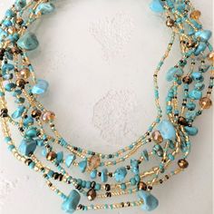 Artisan Czech Glass Bead 6 Strand 18" Long Fashion Statement Necklace Turquoise Gold A Total Length Of 18" Long, With Glass Beads & Semi Precious Stone Chips. Easy To Open/Close Magnetic Clasp. One Of A Kind Necklace Handcrafted/No Two Are Exactly Alike Czech Glass Beads Are Know World Wide For Their Quality, Vibrant Colors Handmade In Guatemala Using Artisan Crafted Czech Glass Beads. Principles Of Fair Trade Are Upheld. Jewelry Trending, Artisan Necklace With Gemstone Beads And Czech Glass, Long Necklaces, Glass Bead Jewelry, Beaded Necklace Ideas, Unique Turquoise Glass Beaded Necklaces, Turquoise Beaded Czech Glass Necklace, Multi-strand Czech Glass Beaded Necklaces With Faceted Beads, Multi-strand Colorful Czech Glass Beaded Necklaces