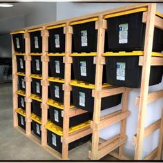 the shelves are filled with black and yellow containers